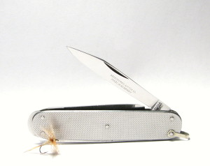 A Limited Number Of PUMA Model 854 Fly Fishing Knives Were Made For Abercrombie & Fitch. A Scant 3.25″ In Length, Tools Include A Main Blade, Screwdriver, File, Pick, Scissors And A Multipurpose Lip On The End Opposite The Nickel Silver Shackle. According To Ken Tarpey (The Puma Knife Man) The Model 854 Is Arguably As Rare As The PUMA "Goldfish", Model 929.