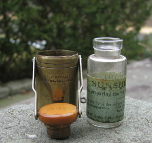 This Particular “Zephyr” Pocket Bottle Raises Some Questions …Or, Perhaps Answers Them. As Mentioned Above, The First Version Zephyr Pocket Bottles Are Found With Glass Inner Bottles, Which Coincidentally Are Exactly The Same As The Original “Sunshine” Dry Fly Oil Bottles, But With No Label. So, Which Came First; Zephyr Dry Fly Oil, Or Sunshine Dry Fly Oil? Perhaps The Earliest Zephyr Pocket Bottles Were Originally Sold With Labeled Sunshine Bottles? This Makes Sense As It Would Make Replenishing Your Dry Fly Oil Far More Simplistic Than Pouring The Preparation From The Much Larger Glass Bottle Of Zephyr Oil Into The Smaller Pocket Bottle. Instead, Anglers Would Simply Insert A New Bottle. Maybe Someone In The Marketing Department Just Didn’t Like The Sound Of “Sunshine Pocket Bottle”.
