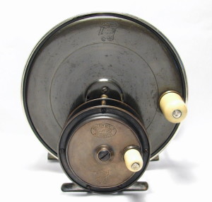 Hardy's Largest (5") Half-Ebonite Birmingham Reel And Their Smallest (2.5" Hercules Reel, Both With Rod-In-Hand Logos